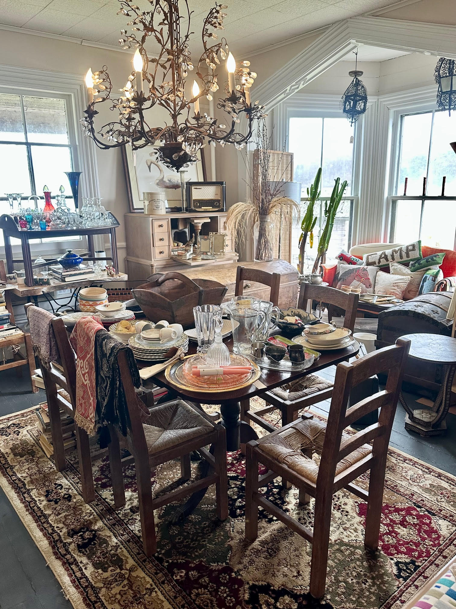 Antique dining room table and chairs, antique furniture, pillows. linens and tableware